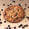 California Chip cookie - chocolate chip dough with coconut mixed in and topped with toasted almonds